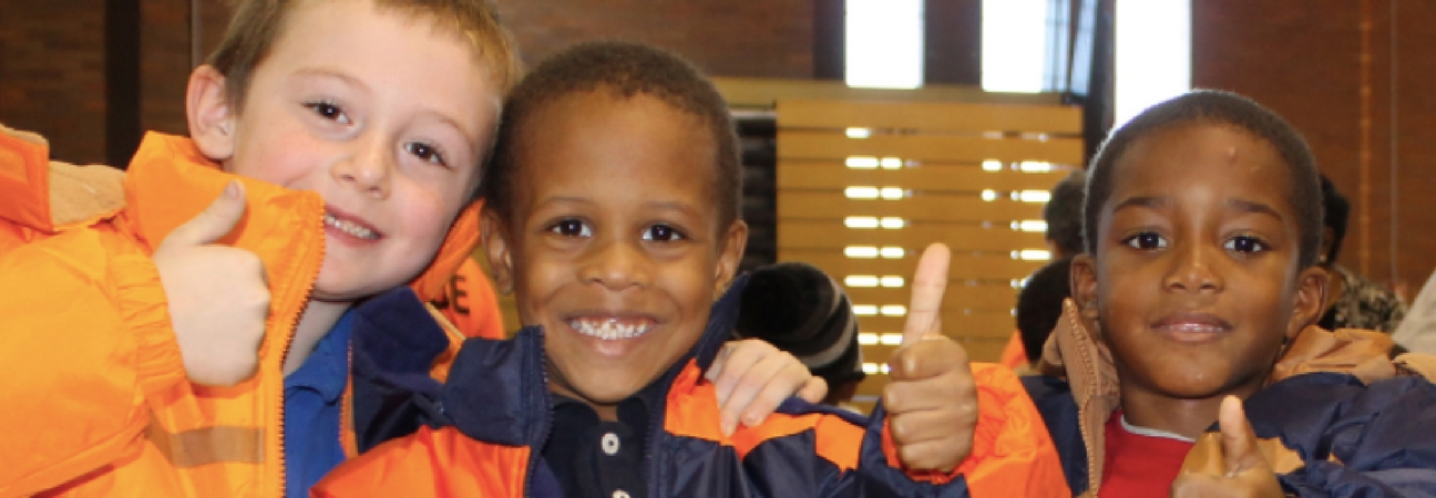 Three children giving thumbs up featured in a blog post about the Driving Away the Cold fundraising campaign