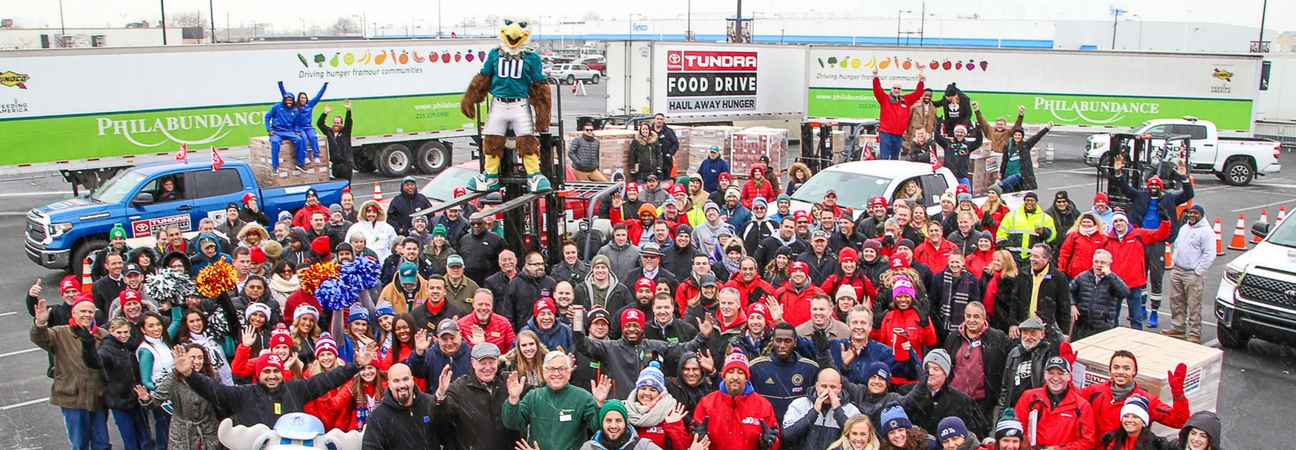 A group of people at the Toyota Tundra Food Drive