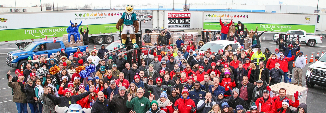 A group of people at the Toyota Tundra Food Drive