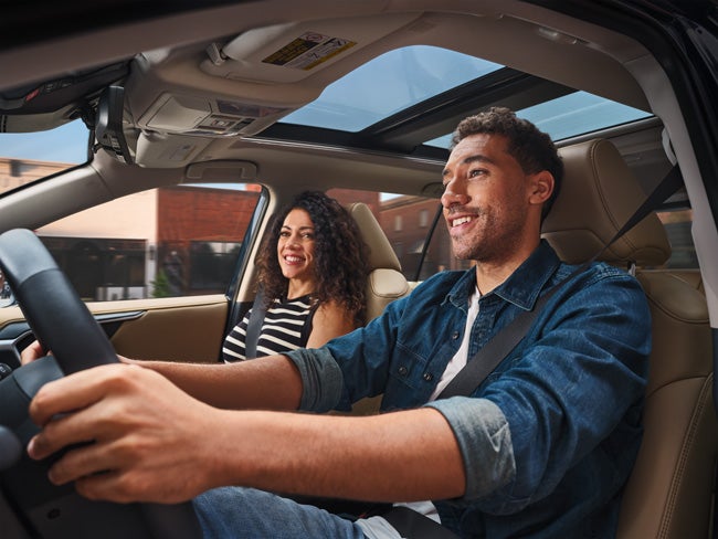 Toyota interior driving with panoramic roof