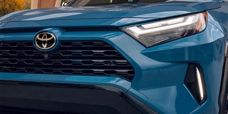 The front grille and headlight details on the 2025 Toyota RAV4 Hybrid in Ardmore, PA