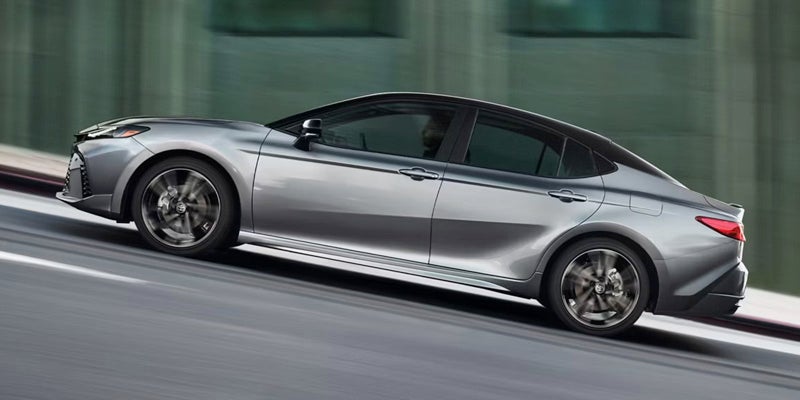 The side view of a 2026 Toyota Camry going uphill in Ardmore, PA