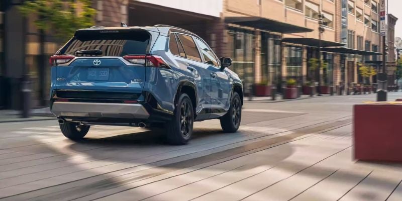 Toyota RAV4 rear exterior city drive view